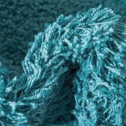 Top Square Tapis épais Shaggy Shag II - Polypropylène / Coton - Turquoise - Diamètre : 120 cm 17 Top Square Tapis épais Shaggy Shag II - Polypropylène / Coton - Turquoise - Diamètre : 120 cm -Tapis Soldes Boutique 1000285001 210819 14411304393 DETAILS P000000001000285001